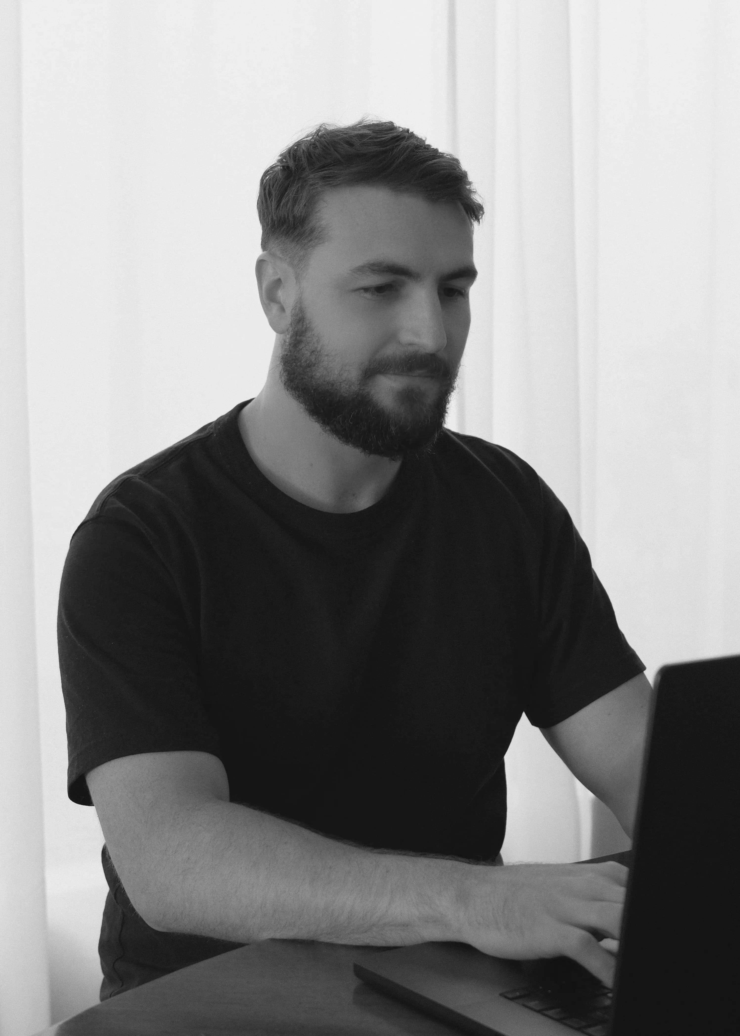 Nathan King working on his laptop